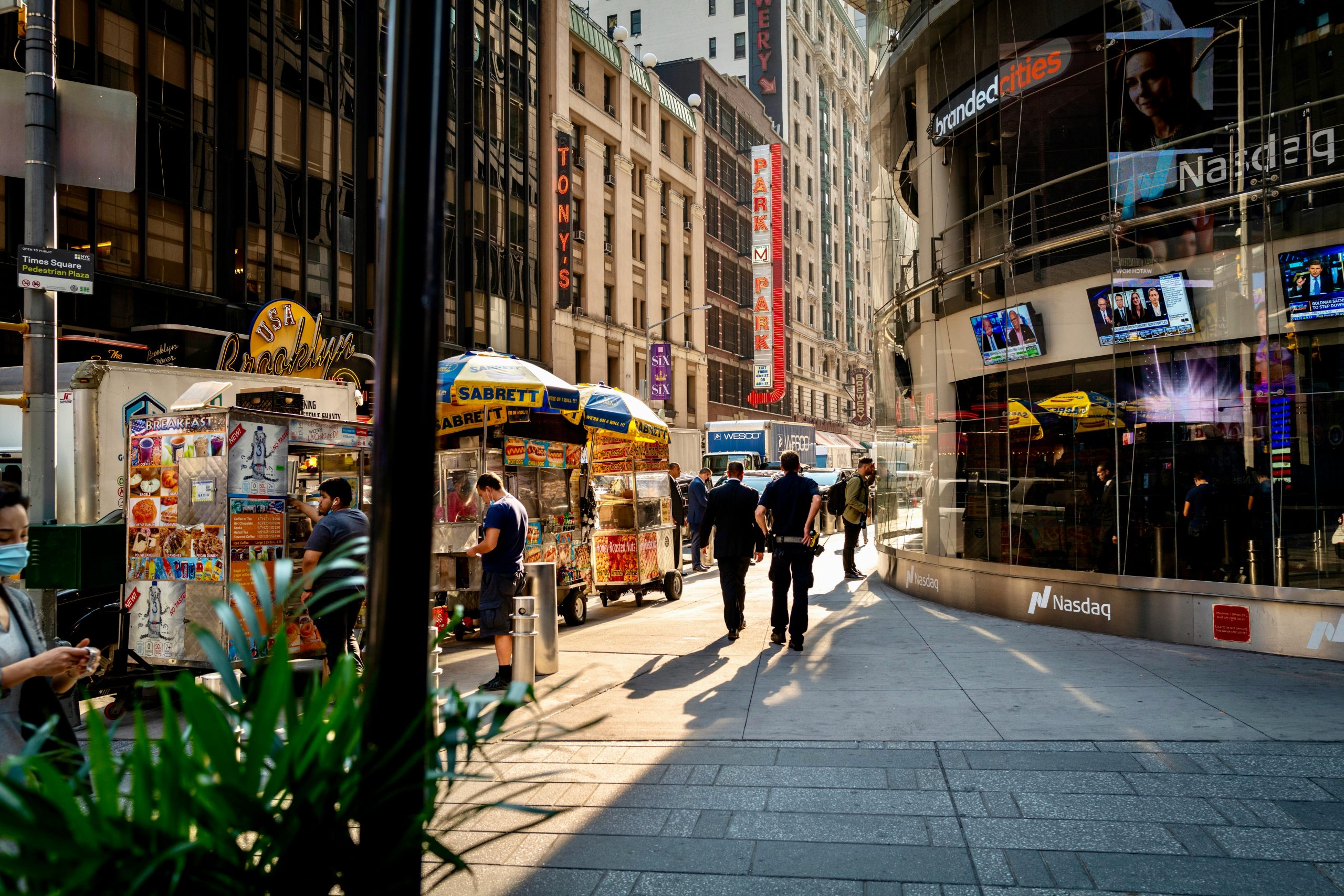 Bustling street vendors and pedestrians in iconic Times Square, New York City.